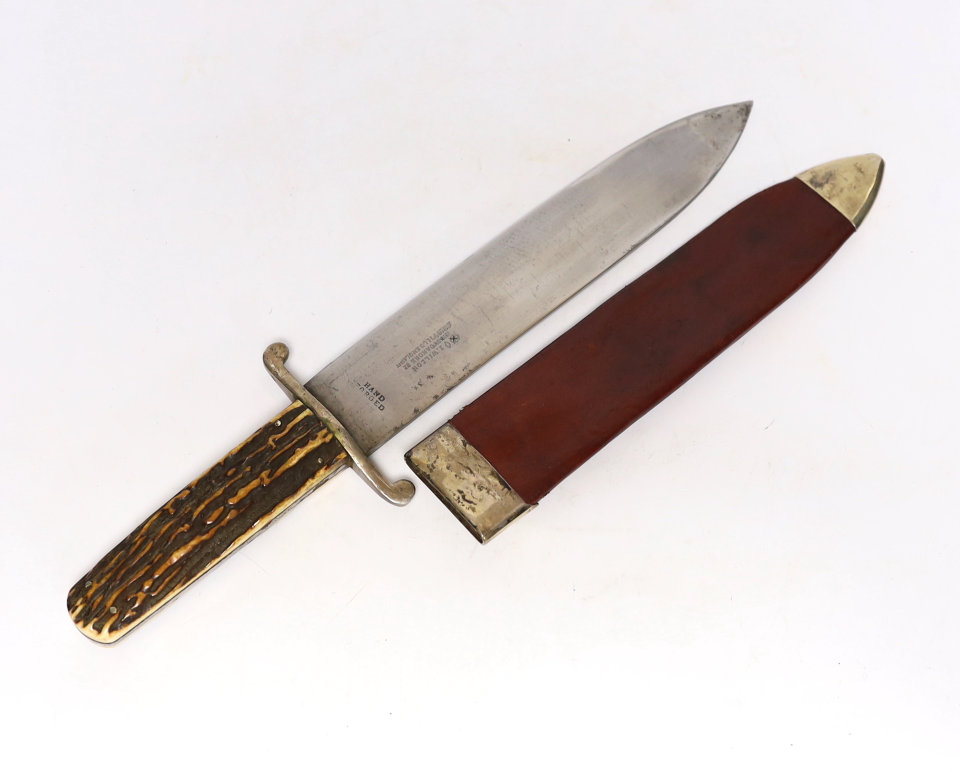 A John Wilson 19th century Bowie knife, spearpoint blade, stamped hand, forged, J, Wilson Sycamore Street, Sheffield, with peppercorn and diamond trade marks, horn, grip, and red leather scabbard with rose pattern stud,